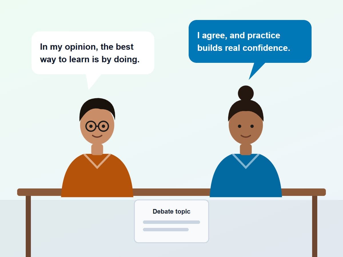 Two students at a desk having an English discussion with speech bubbles