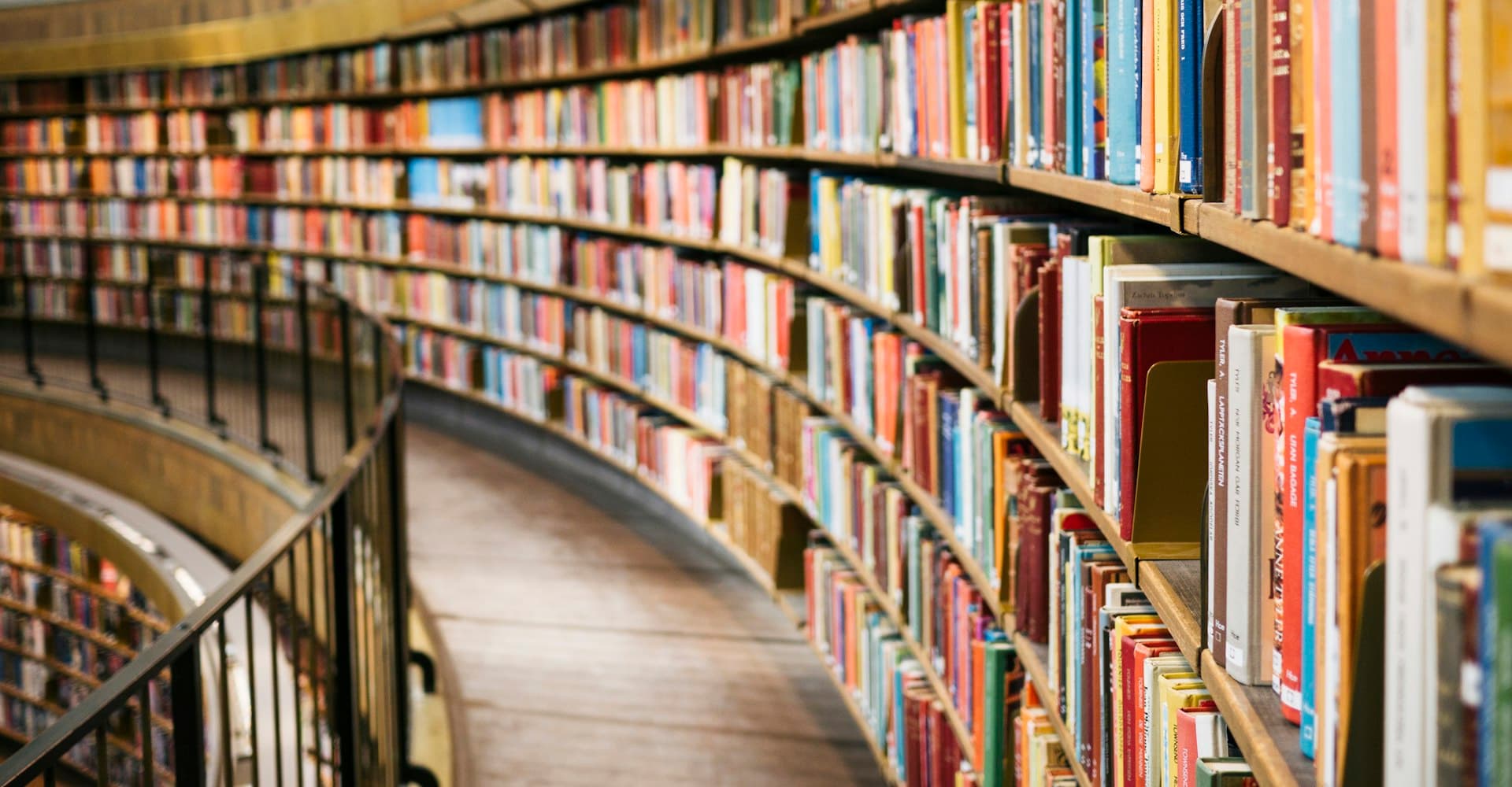 Rows of bookshelves in a library, representing depth of learning content